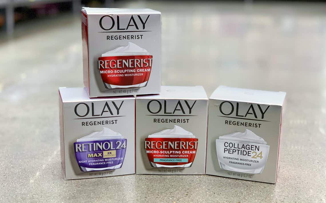 four boxes of olay regenerist creams stacked on walmart floor