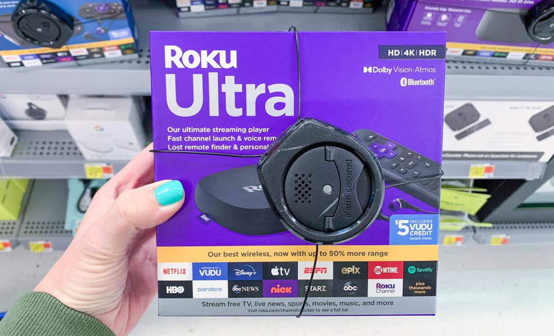 roku ultra streaming device in purple box with spider security system