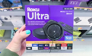 roku ultra streaming device in purple box with spider security system