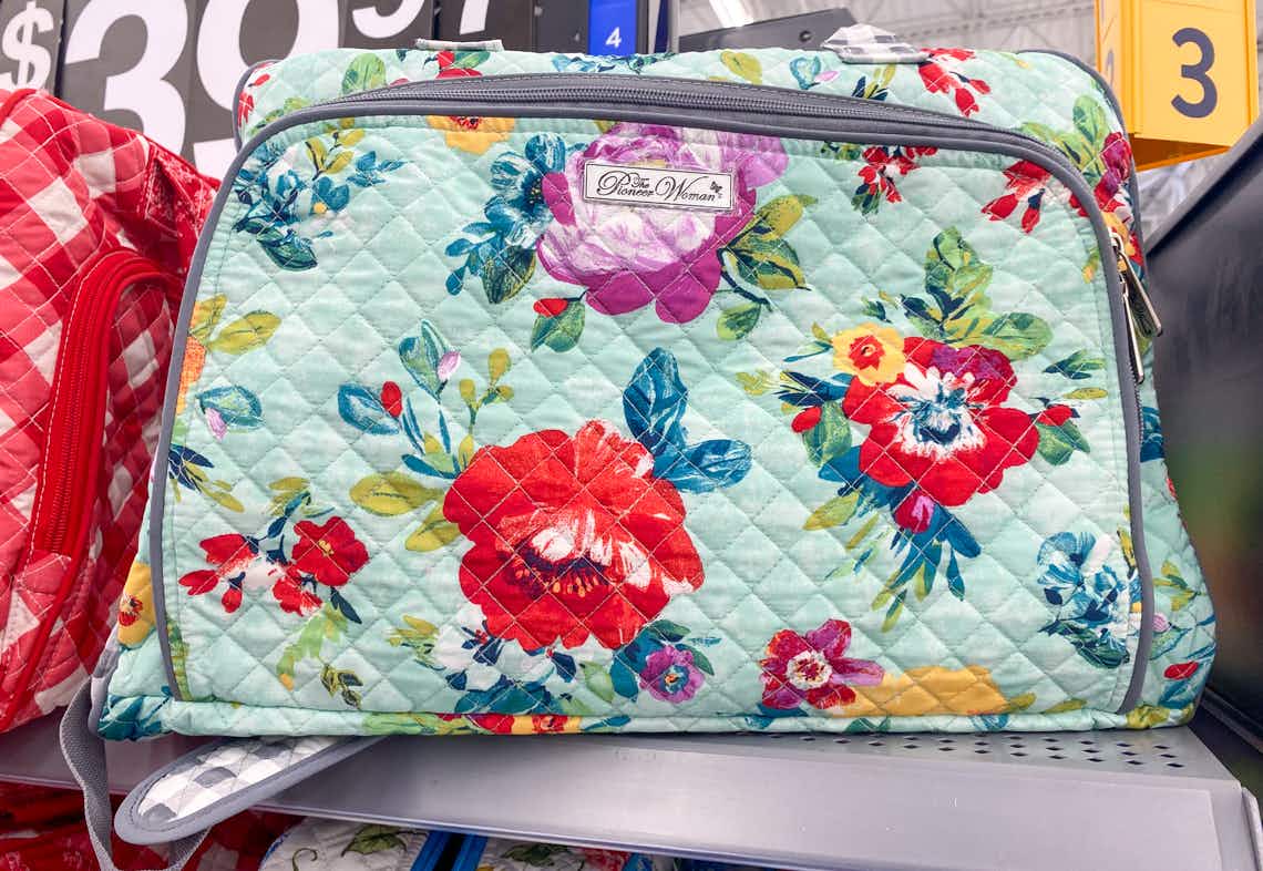 the pioneer woman quilted travel tote on walmart shelf