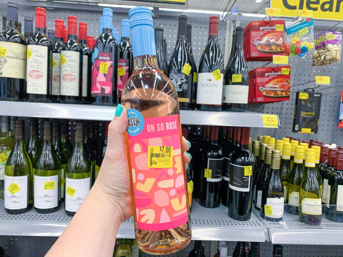 tasty rose wine held in front of clearance wine selection