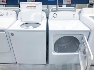 washer and dryer on display with doors open at Lowes