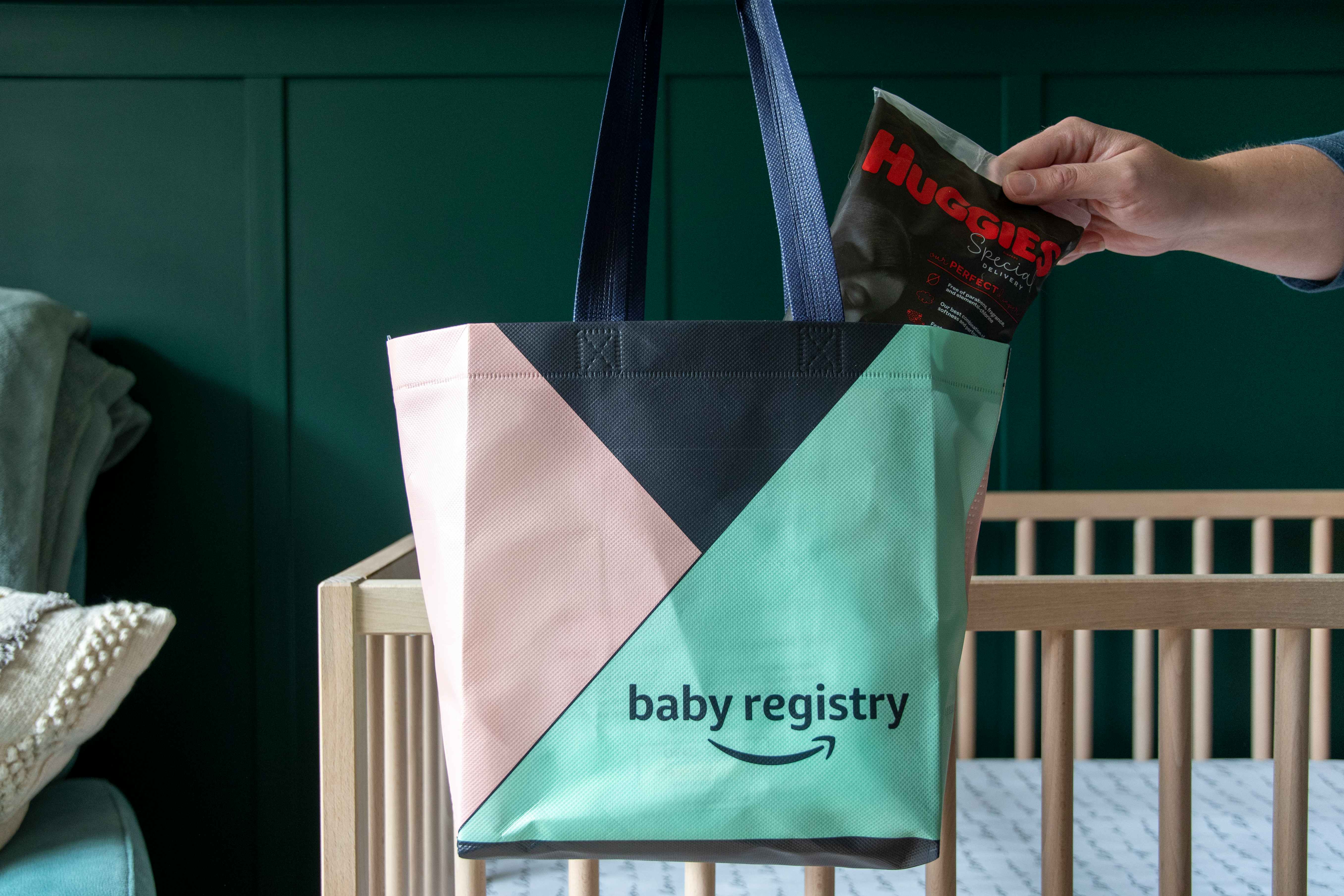 A sample of Huggies diapers being pulled from an amazon baby registry free welcome bag.