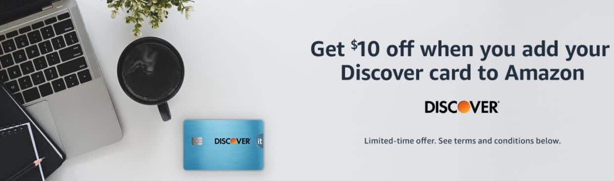 An Amazon banner with a computer, Discover credit card, and offer details.