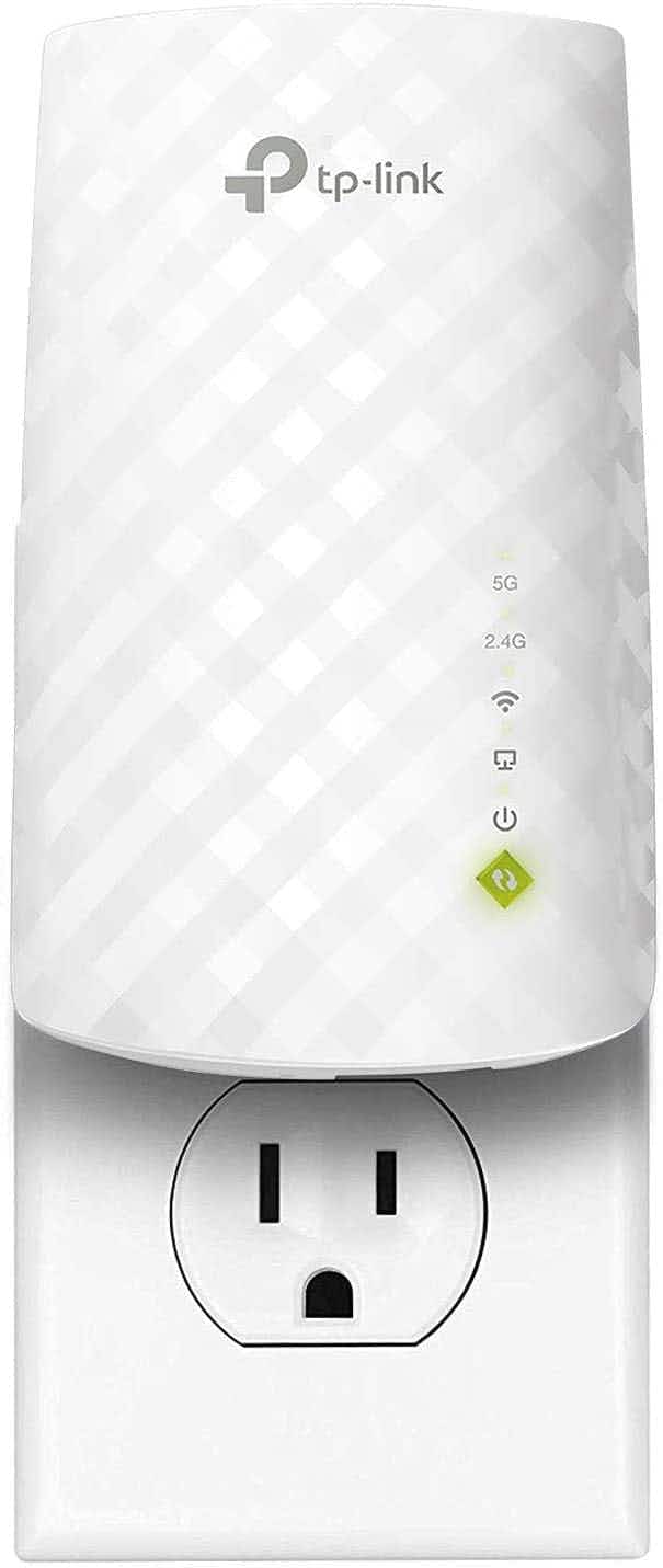 A white WiFi extender plugged in to an outlet.