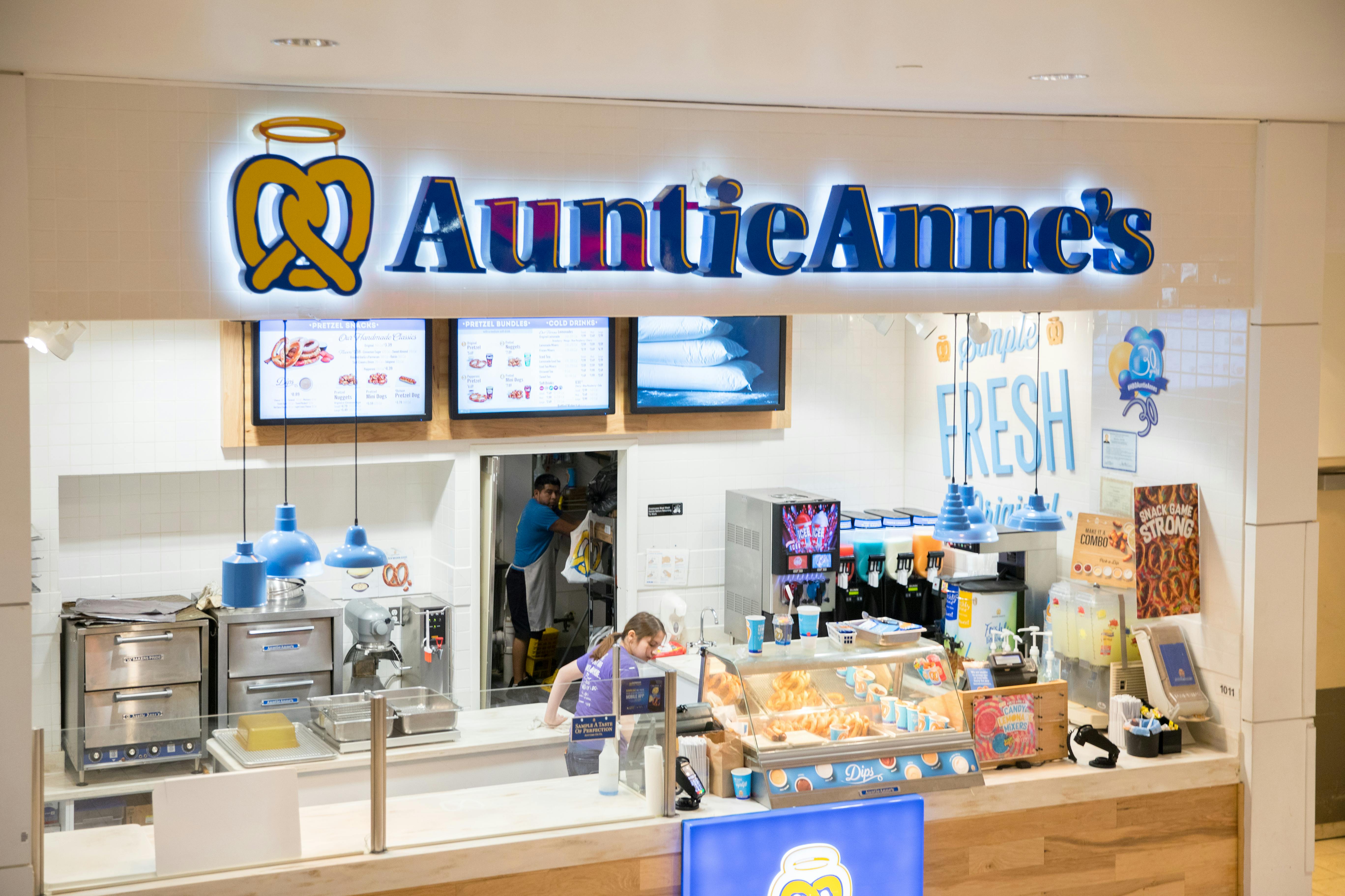 An Auntie Anne's pretzel shop counter inside a mall.