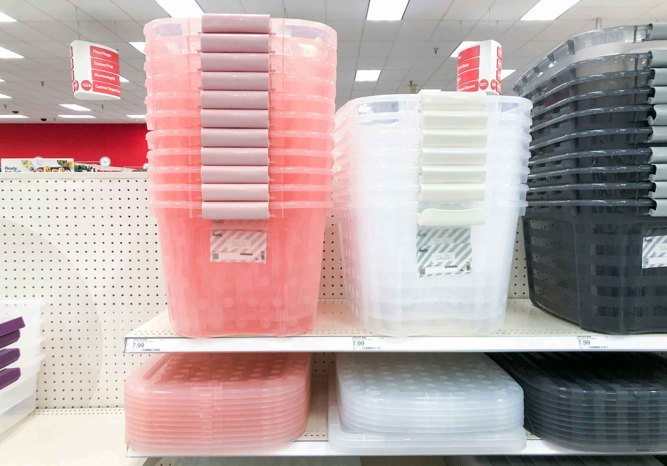 polka dot pibk bins and white bins stacked on store shelf