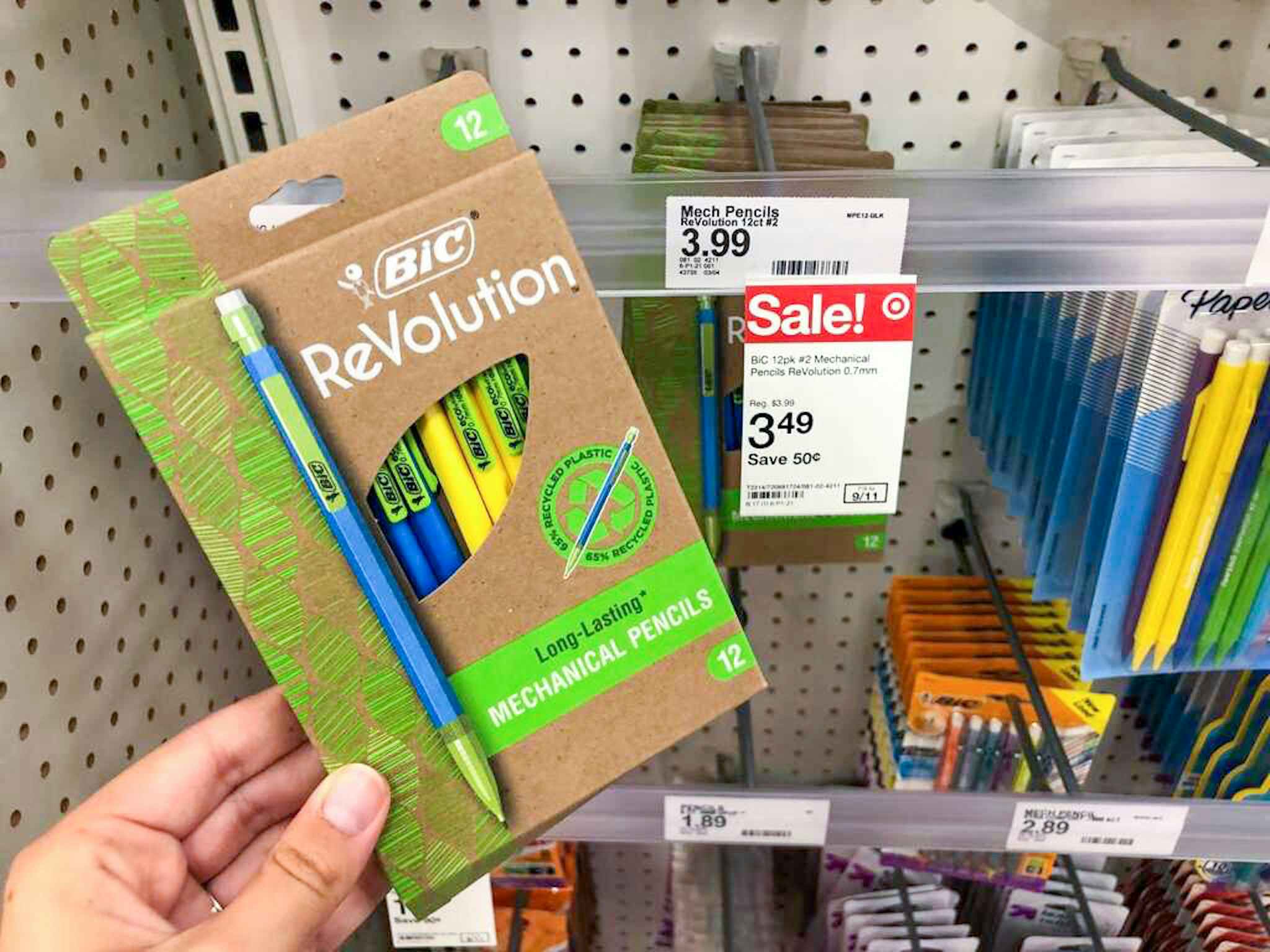 hand holding bic revolution mechanical pencils in front of a target sale tag