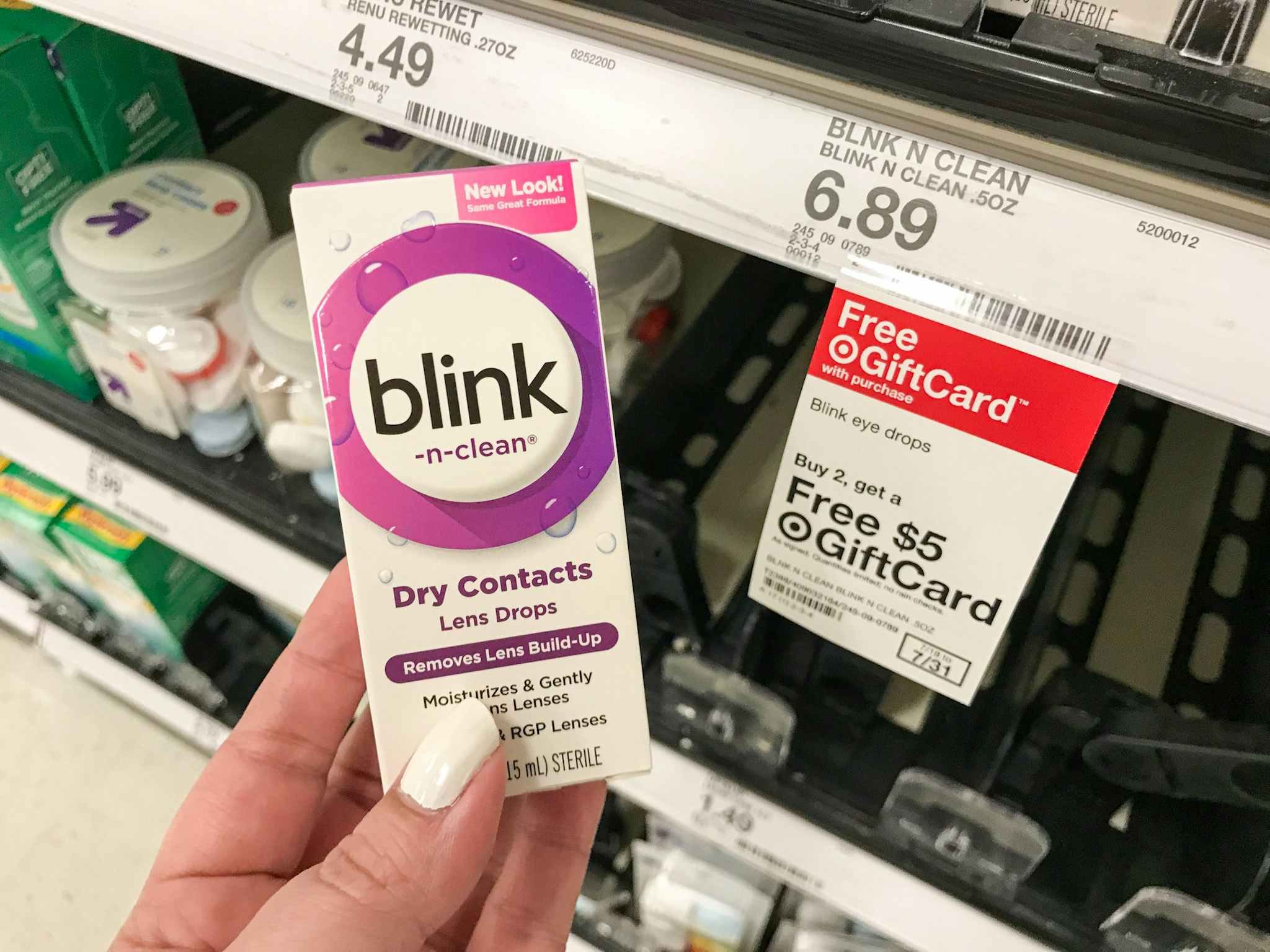 hand holding blink drops in front of Target gift card tag
