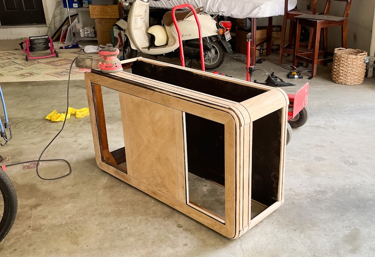 A coffee table being sanded 