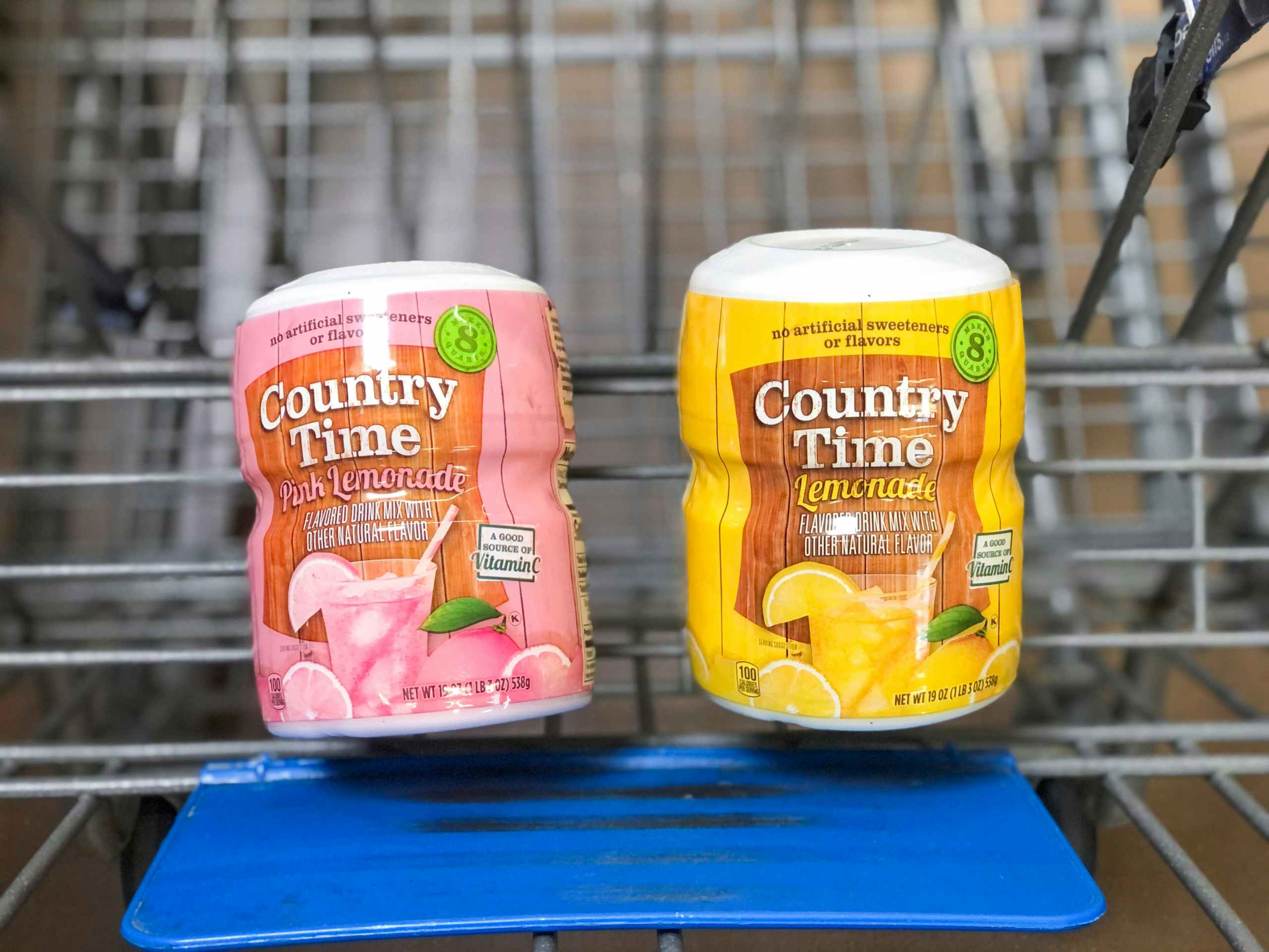 two bottles of lemonade powder in Walmart shopping cart