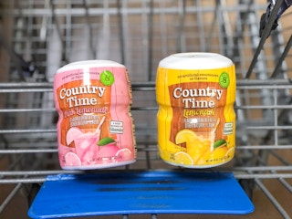 two bottles of lemonade powder in Walmart shopping cart