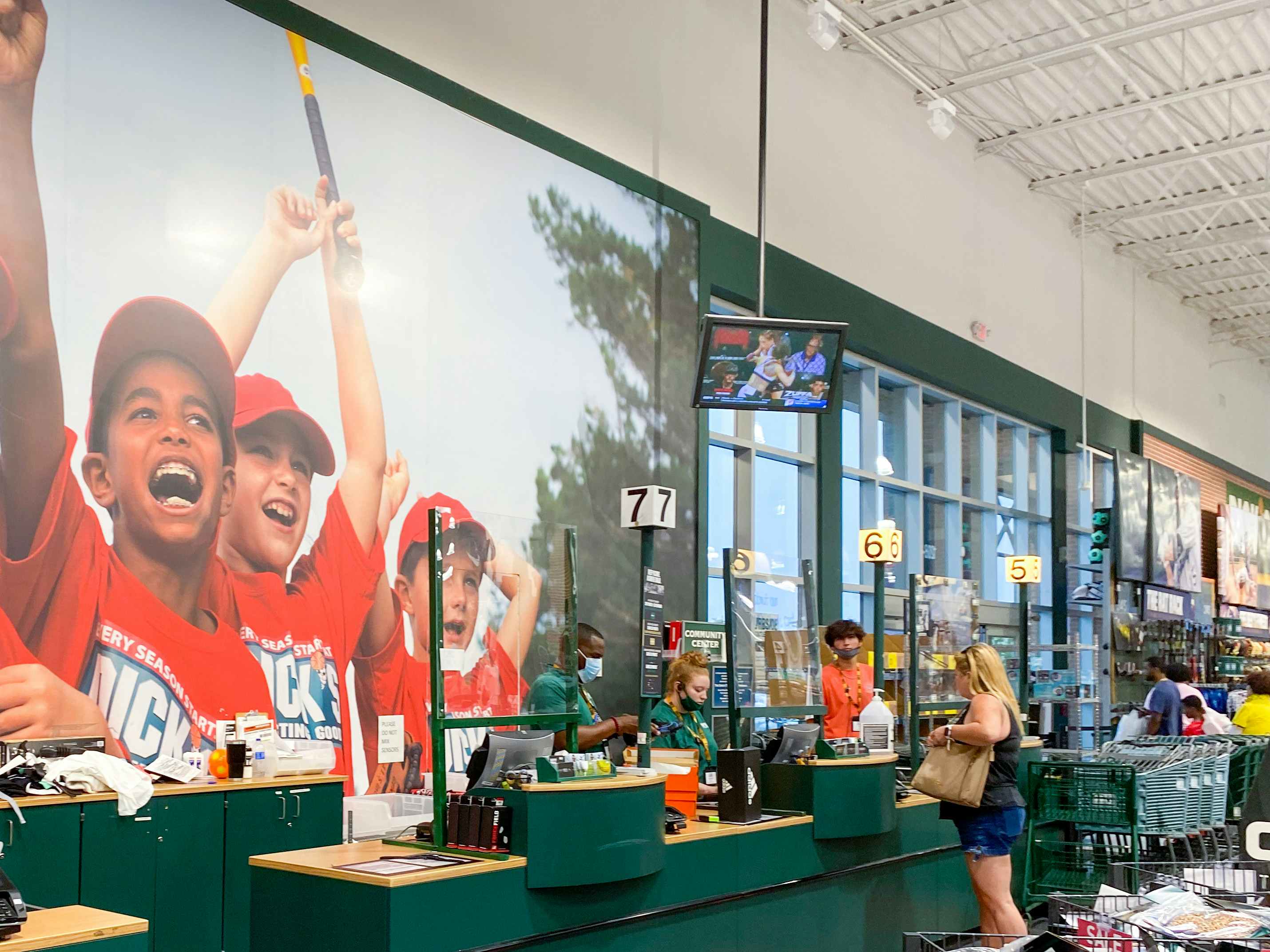 The checkout counters in the front of a Dick's Sporting Goods store.