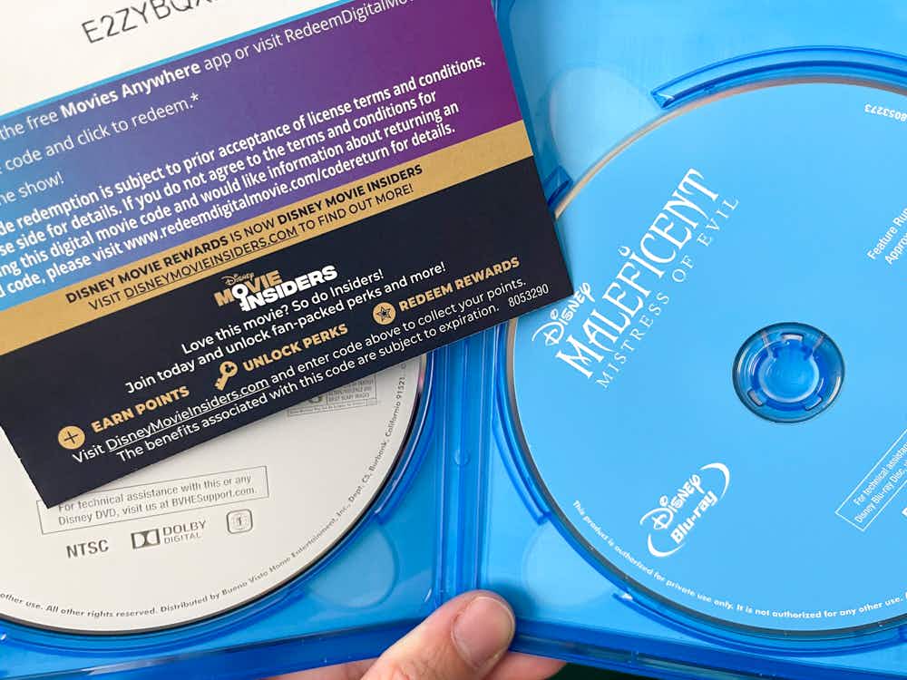 Disney Blu-ray movie case open with a Movie Insider card visible within