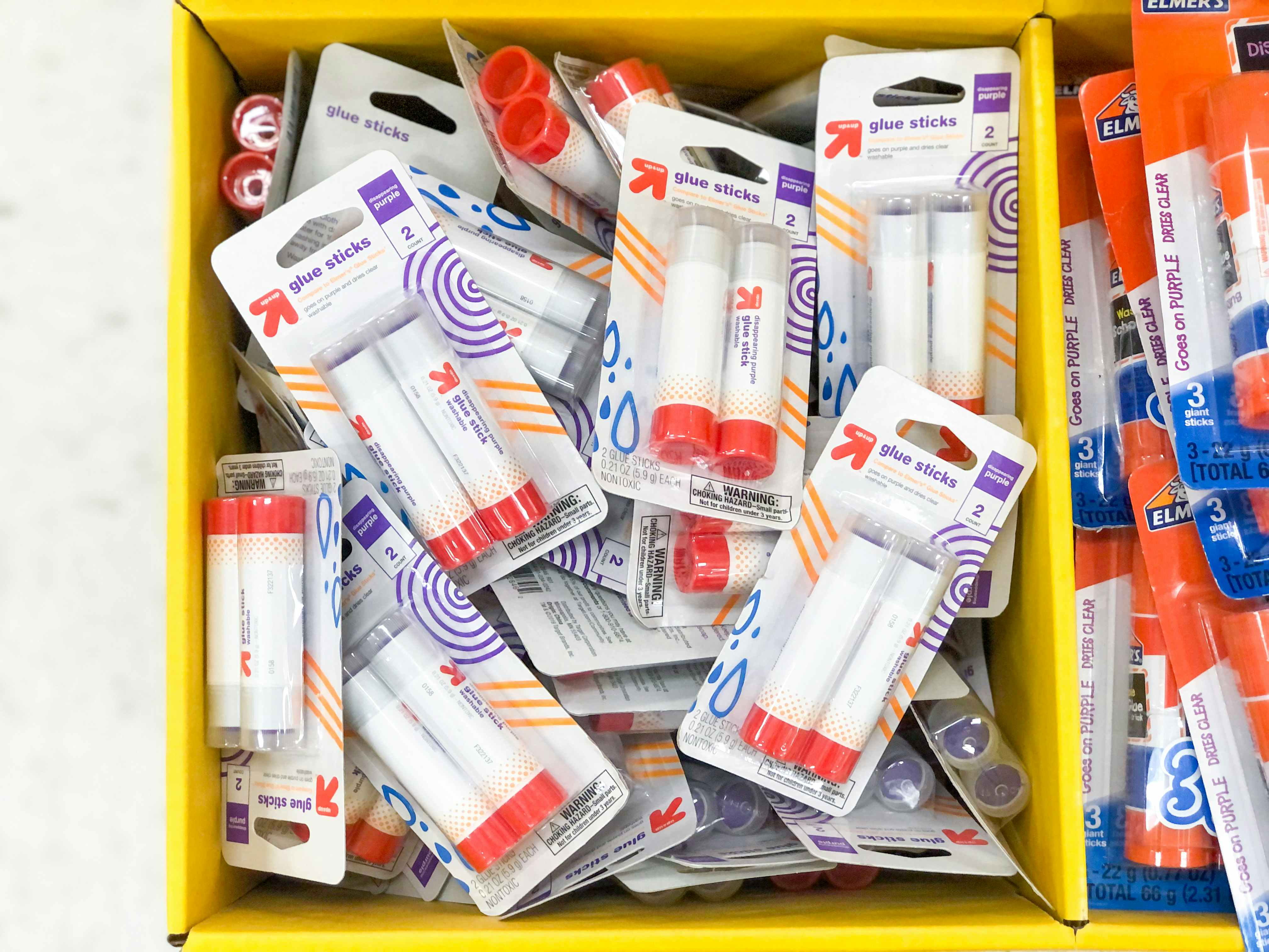 bin of packages of glue sticks at Target