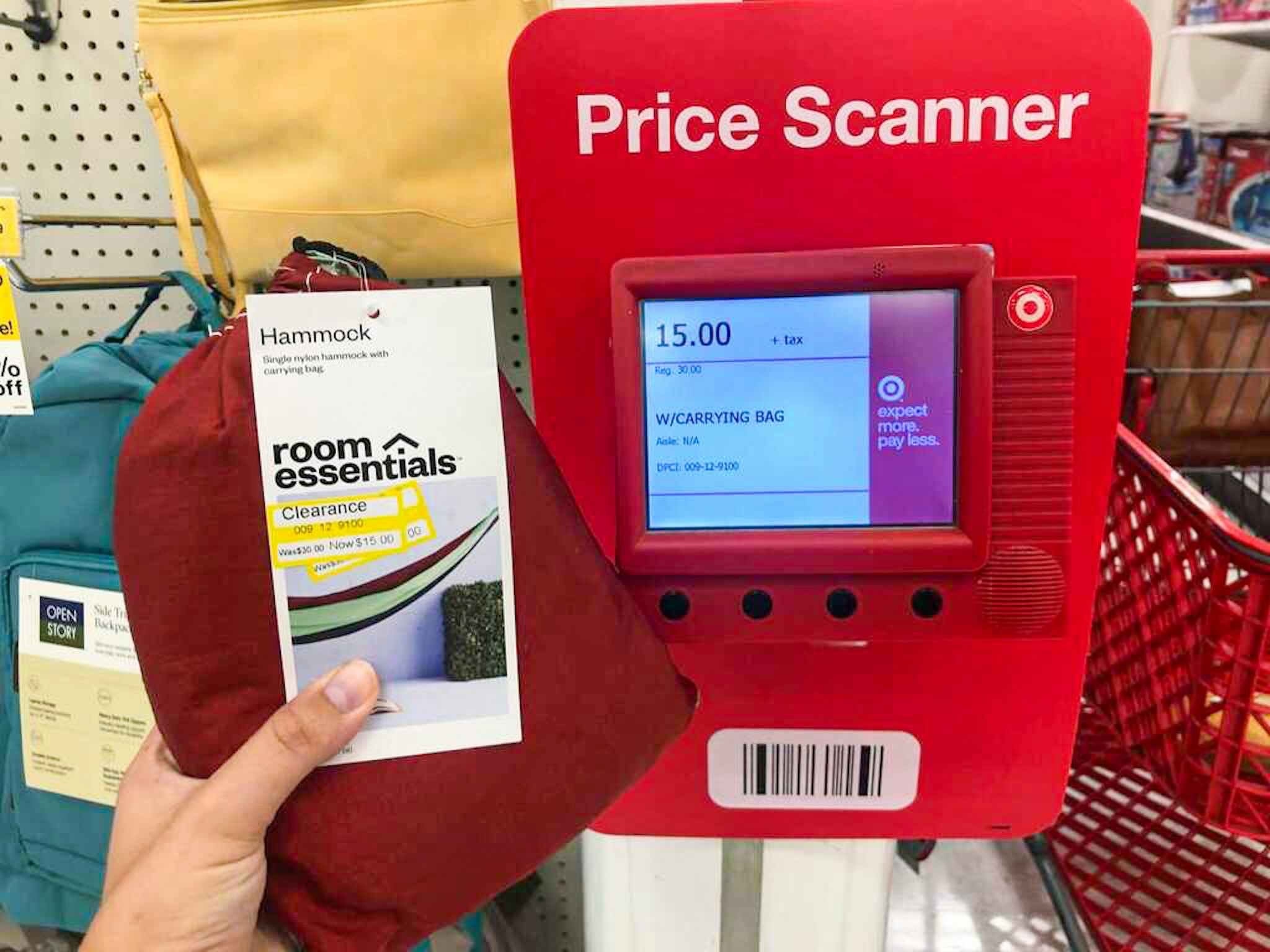 hand holding a room essentials hammock in front of a price checker