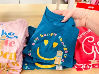 hand holding kids' graphic tee