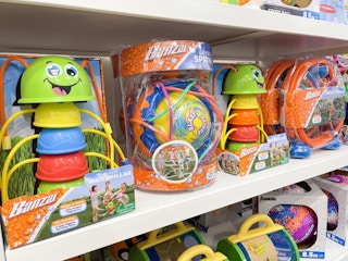 Waterpillar and Geyser Banzai sprinklers stocked on a shelf at Kohl's.
