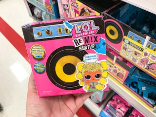 hand holding a lol surprise remix hair flip doll at target