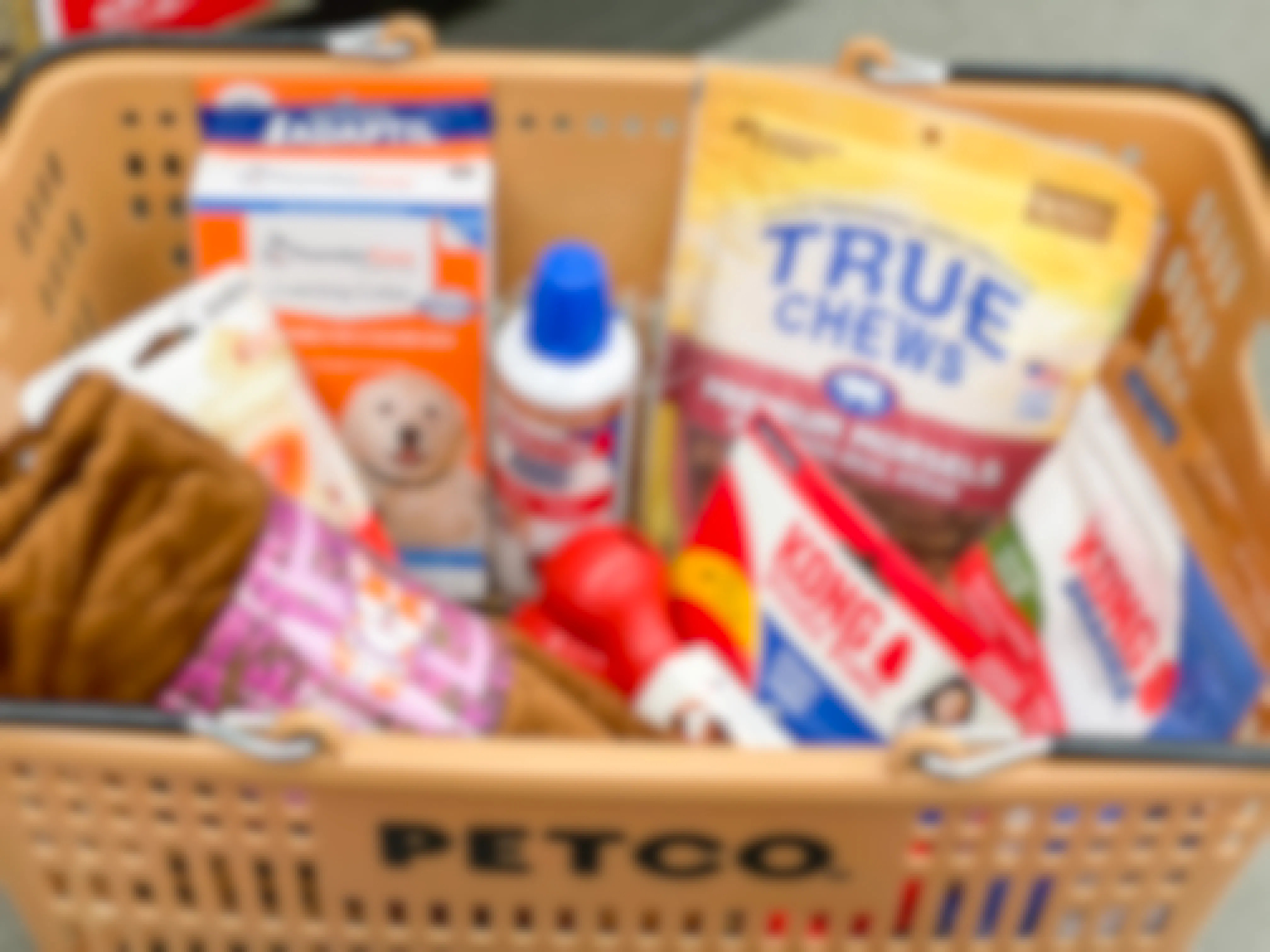 Petco basket with dog toys, dog chews, and other pet supplies