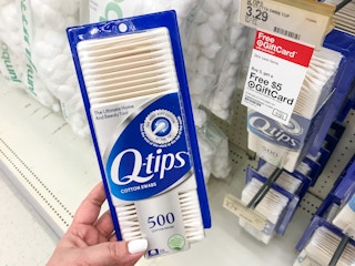 hand holding a box of q-tips cotton swabs at target