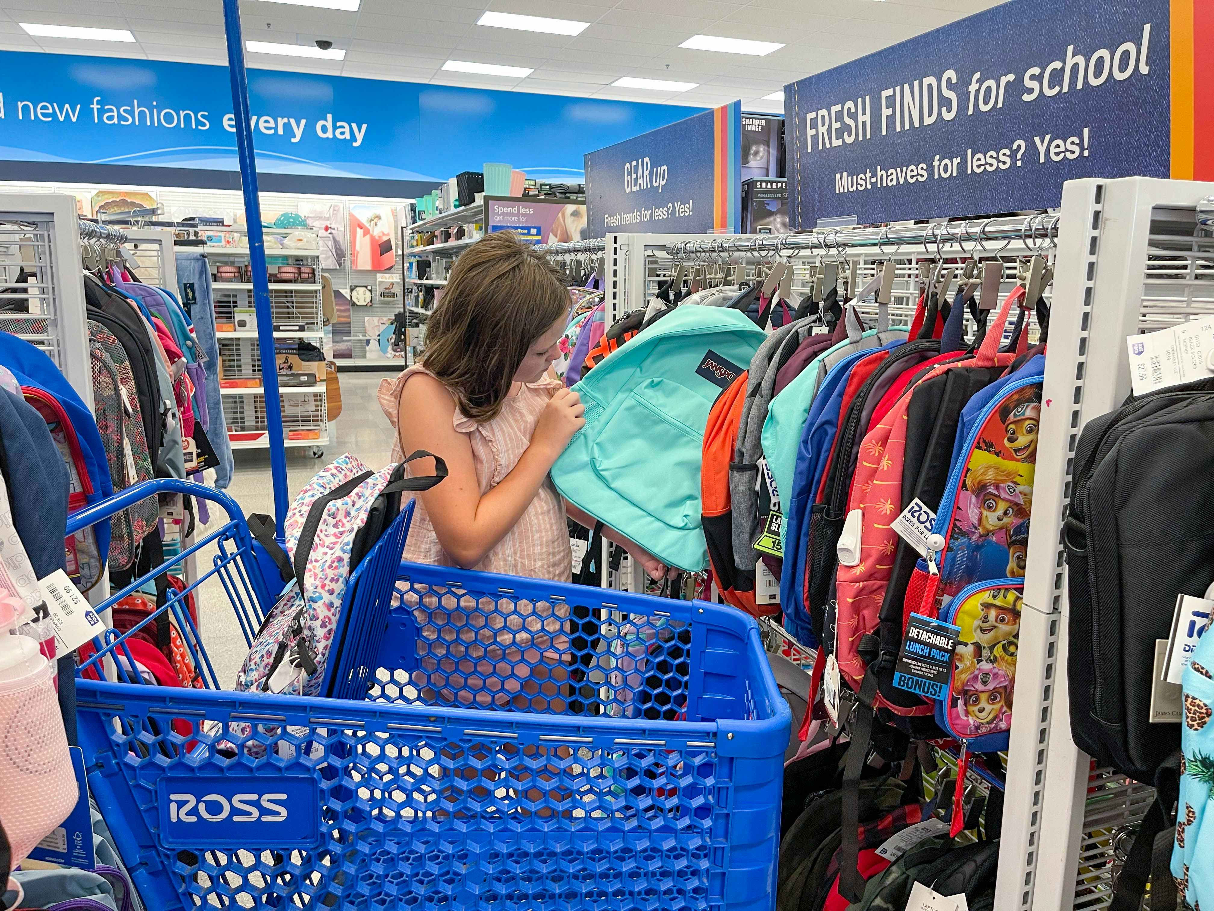 child shopping for backpacks at ross