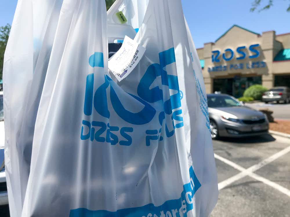 Ross shopping bag held in front of a Ross store.
