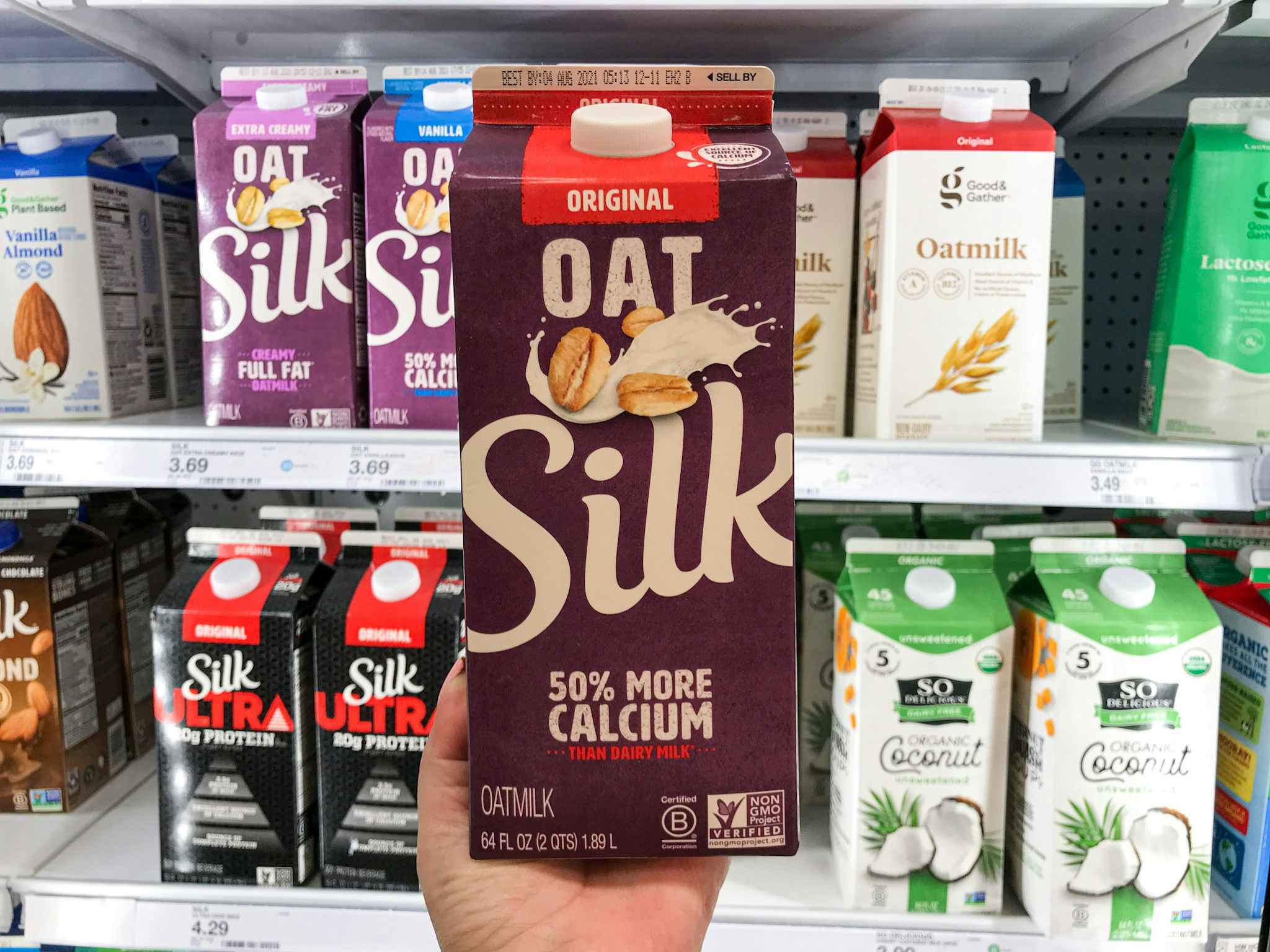 hand holding silk oatmilk at target