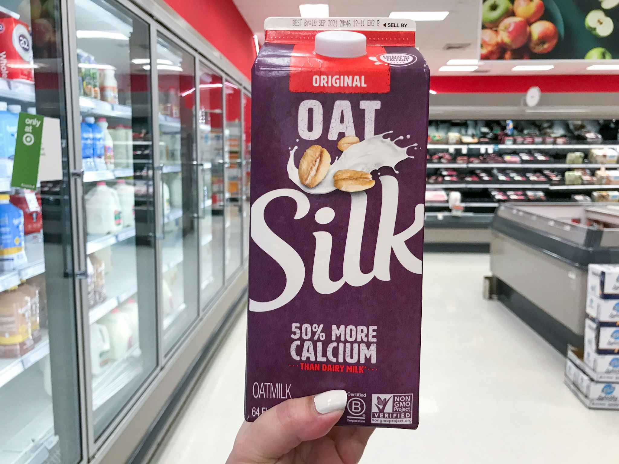 hand holding silk oatmilk at target