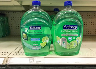 two bottles of Softsoap hand soap refills on store shelf