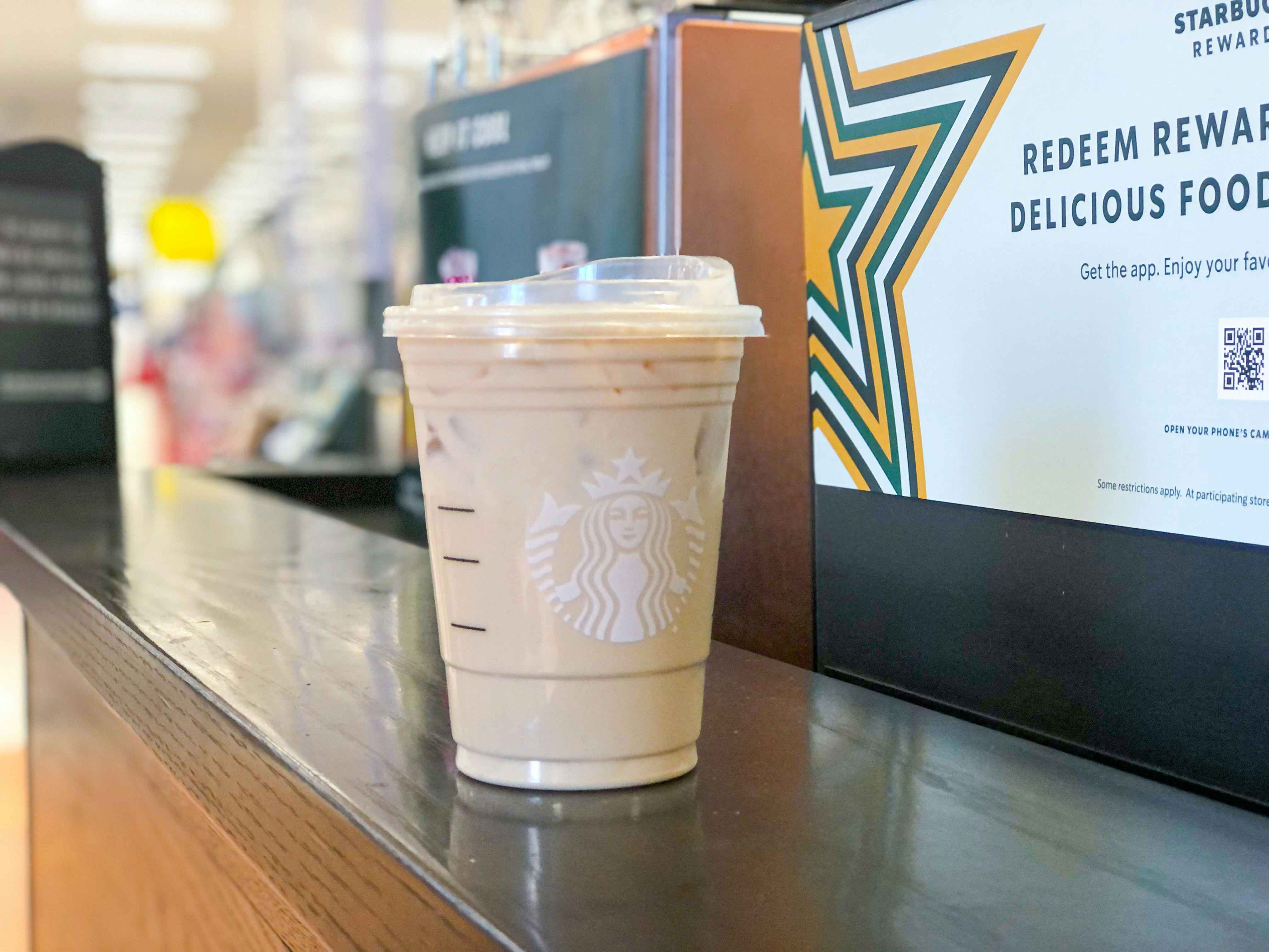 Starbucks iced coffee sitting on Starbucks counter