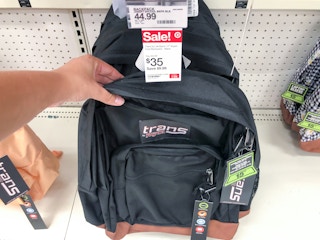 hand grabbing backpack off display at Target