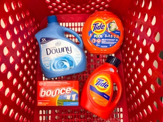 Tide, Downy, Bounce, and Tide Pod bottles together in Target shopping cart