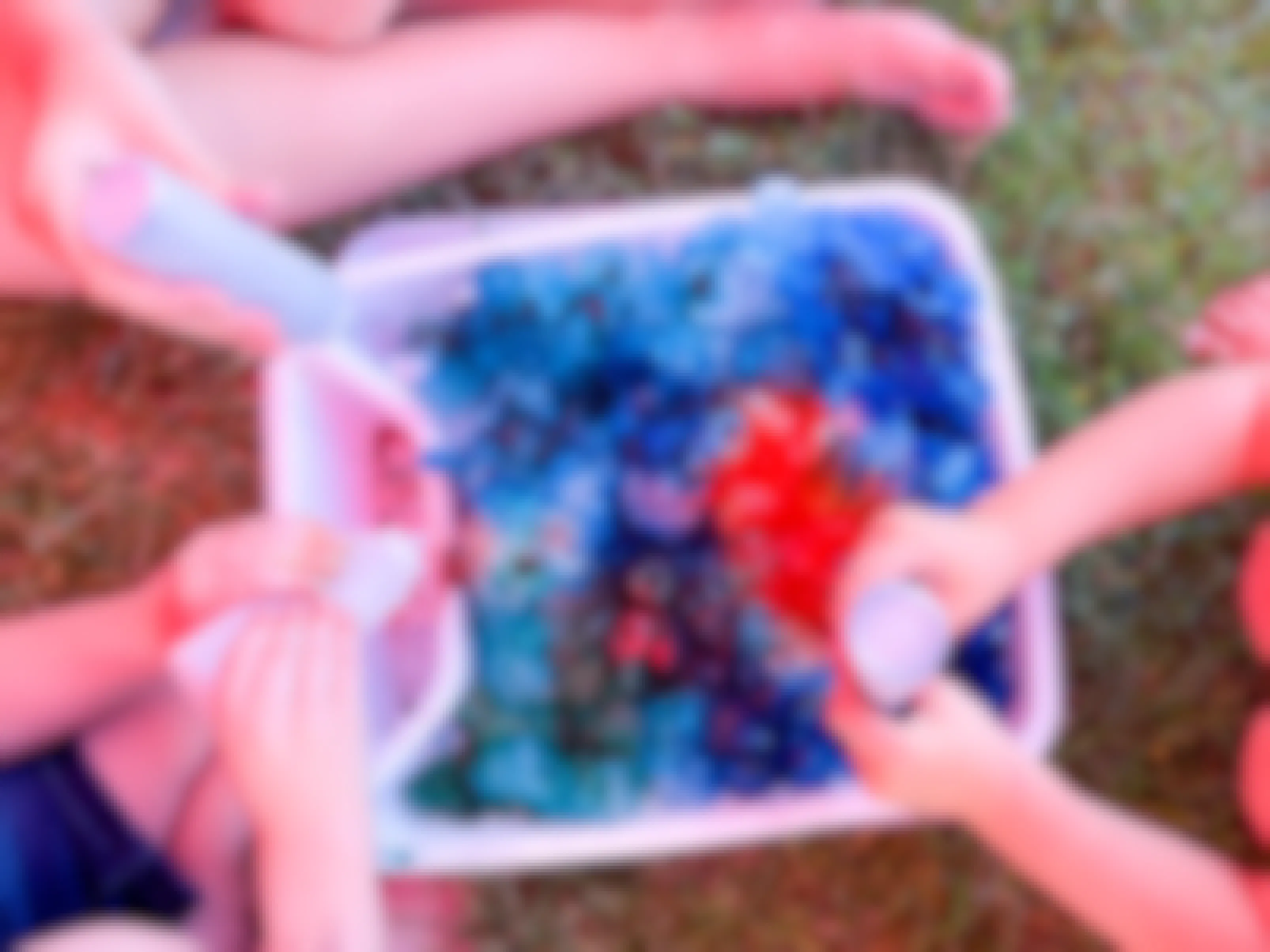 close up of kids making ice tie dye shirts