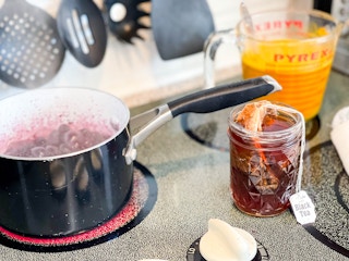 tea and berries boiling on stove top