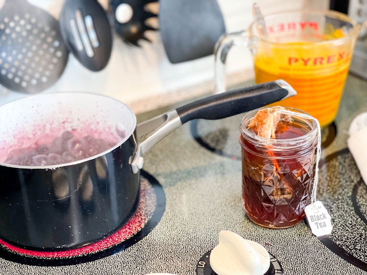 tea and berries boiling on stove top