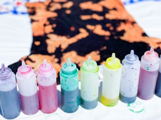 tie dye dye bottles in front of bleached shirt