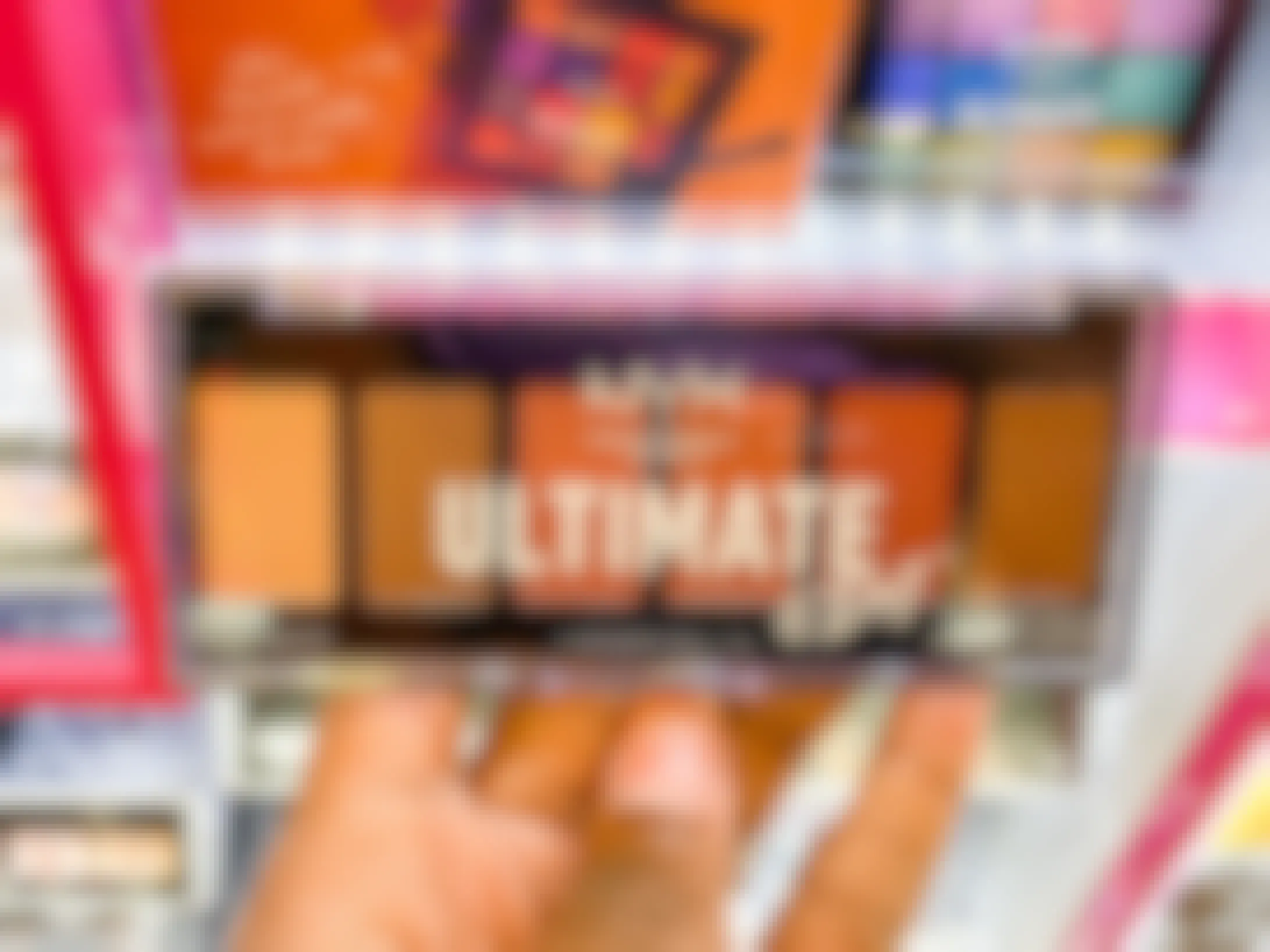 A person's hand holding NYX ultimate edit eyeshadow palette in Ulta.