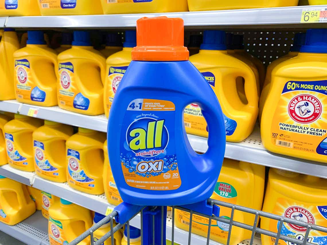 bottle of all oxi liquid laundry detergent on the corner of a walmart cart