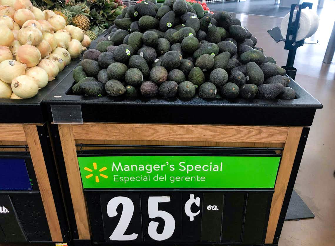 avocados in walmart produce section with manager special sign
