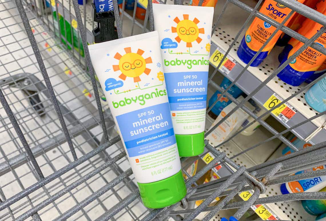 two bottles of babyganics sunscreen in a walmart cart
