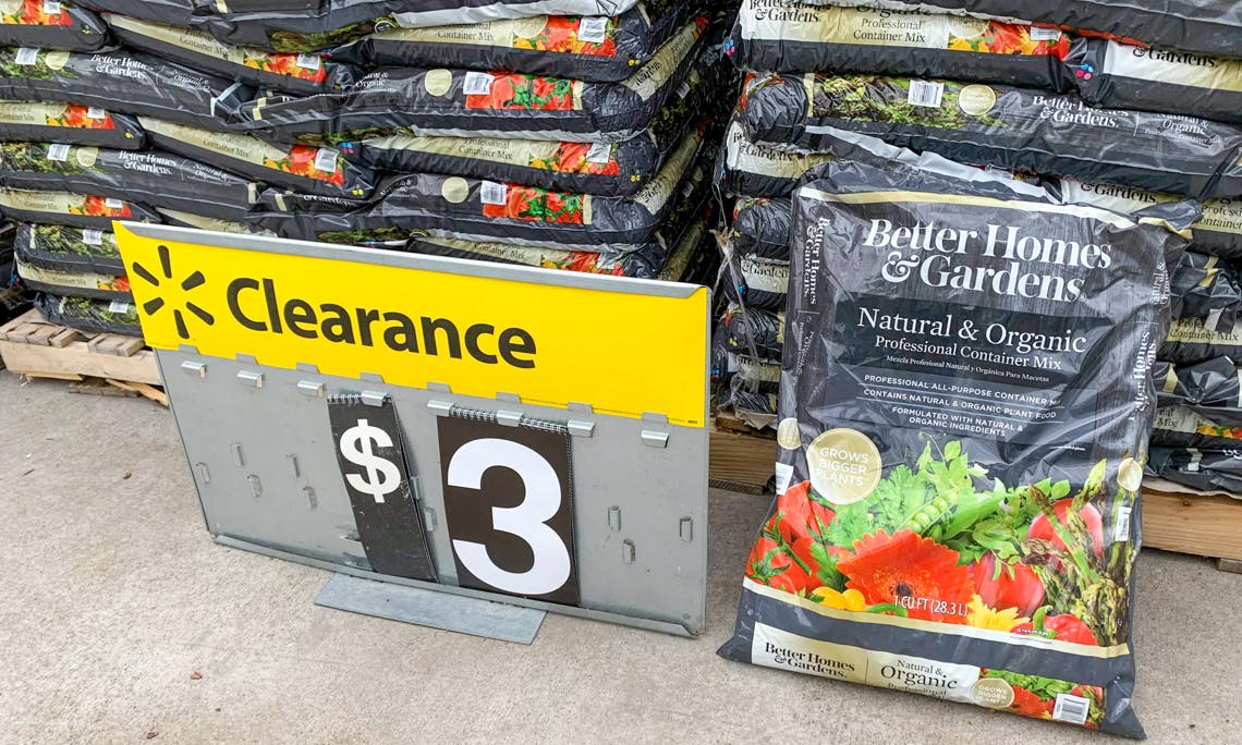better homes and gardens natural and organic potting soil on ground with walmart clearance sign