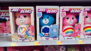 the new care bear togetherness bear with other care bears on walmart shelf