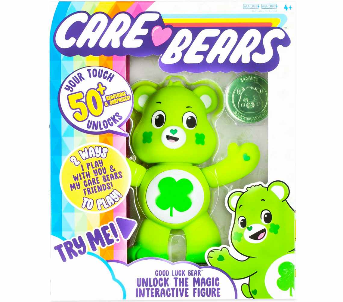 stock photo of care bear good luck bear interactive toy on white background