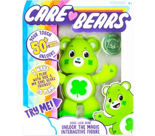 stock photo of care bear good luck bear interactive toy on white background