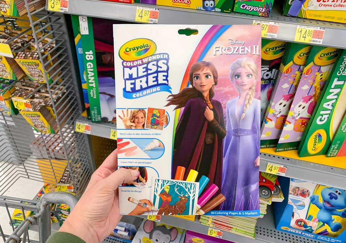 crayola disney frozen II mess free coloring pack held in front of crayola products
