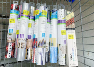 collection of cricut vinyl tubes in walmart cart