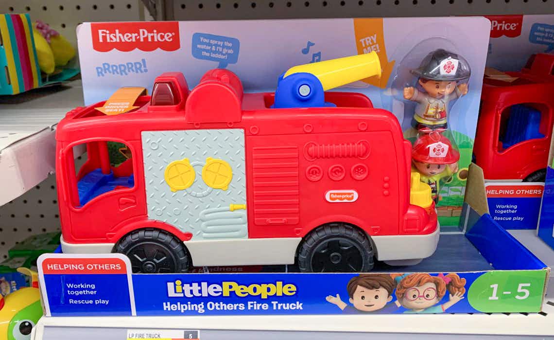 fisher-price little people helping others firetruck toy on shelf