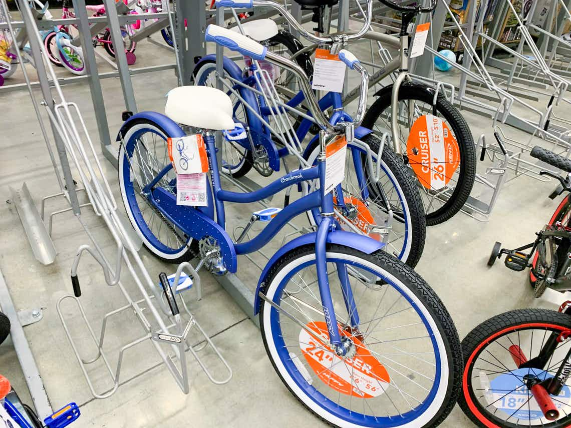 huffy cranbrook periwinkle cruiser adult bike in bike rack at walmart