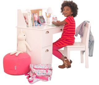 stock photo of girl using the kidkraft study desk on white background
